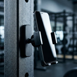 GymPost mounted on a squat rack upright holding a phone
